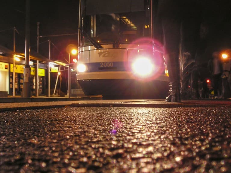 Tram at the stop by night in Grenoble, France