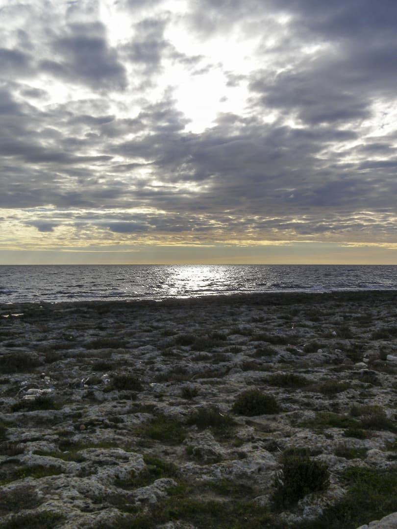 Sunset on the rocky coast of Salento