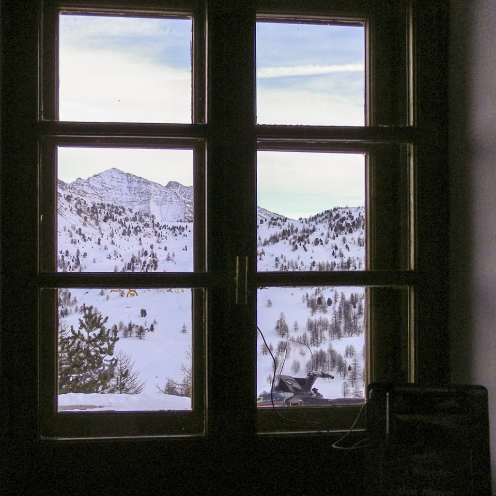 View of the Alps from the window of the refuge on the Black Lake