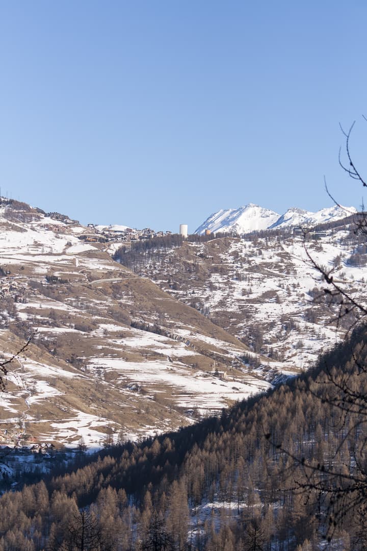 View of the Sestriere hill and hotel tower from the Cesana valley