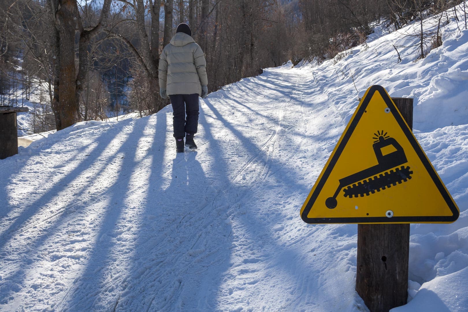 Walking uphill to the Black Lake on the snow-covered road