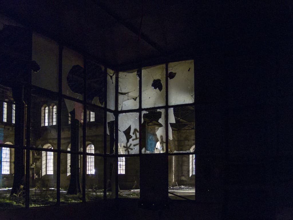 Broken Windows at the Abandoned Train Repairing Workshop in Turin, Italy