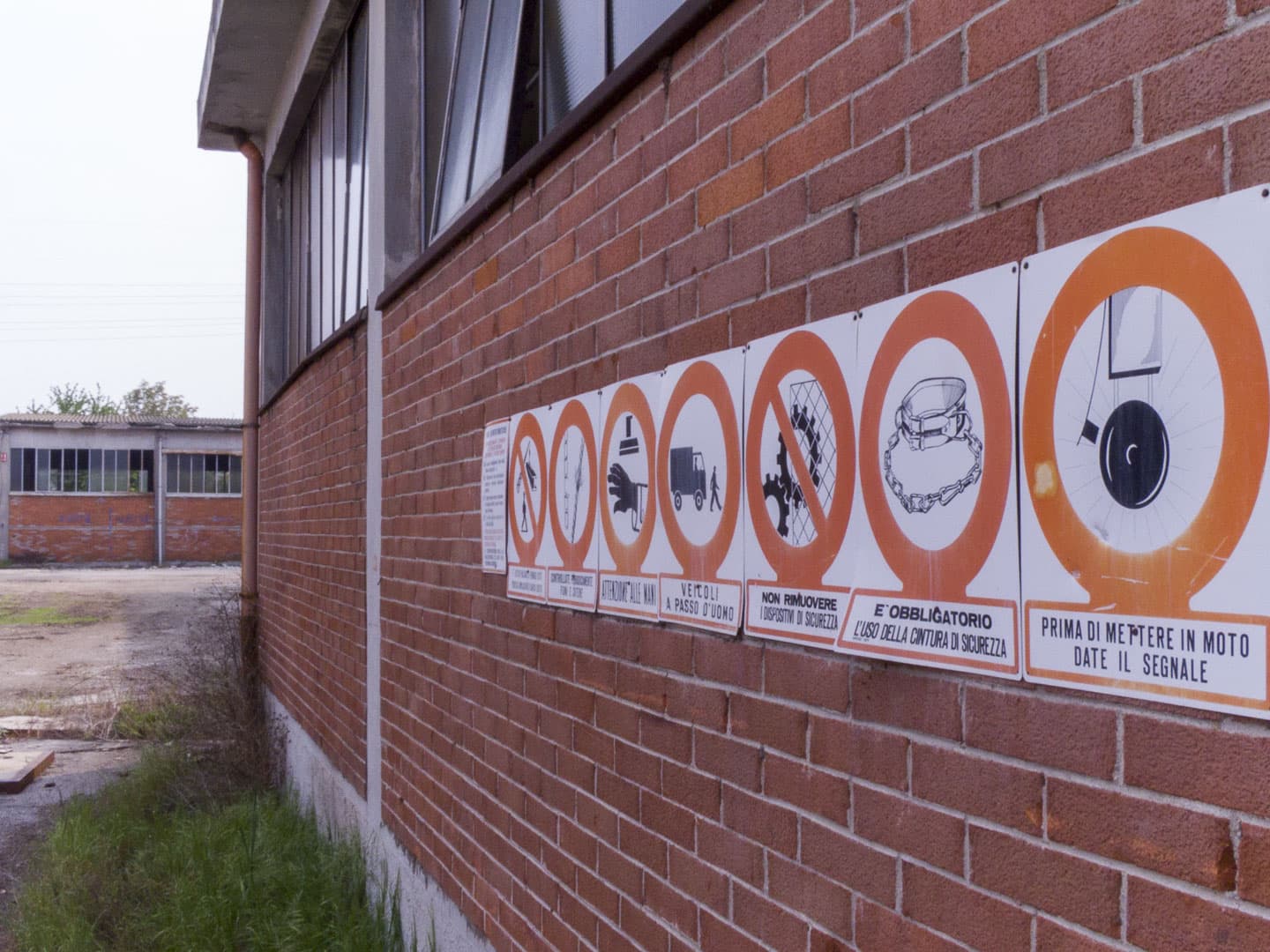 Warning Signs at Unknown Abandoned Factory in Nichelino, Italy